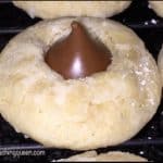 Delicious chocolate kiss cookies on a cooling rack.