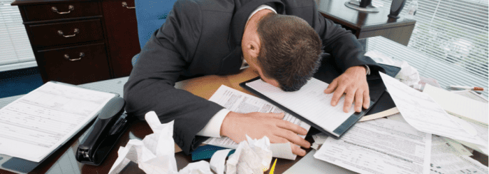 head on desk How Lack of Sleep Can Affect Your Business man office