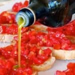 tuscan bruschetta recipe - pouring olive oil
