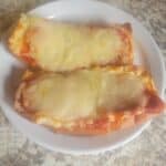 Two slices of pizza on a plate.